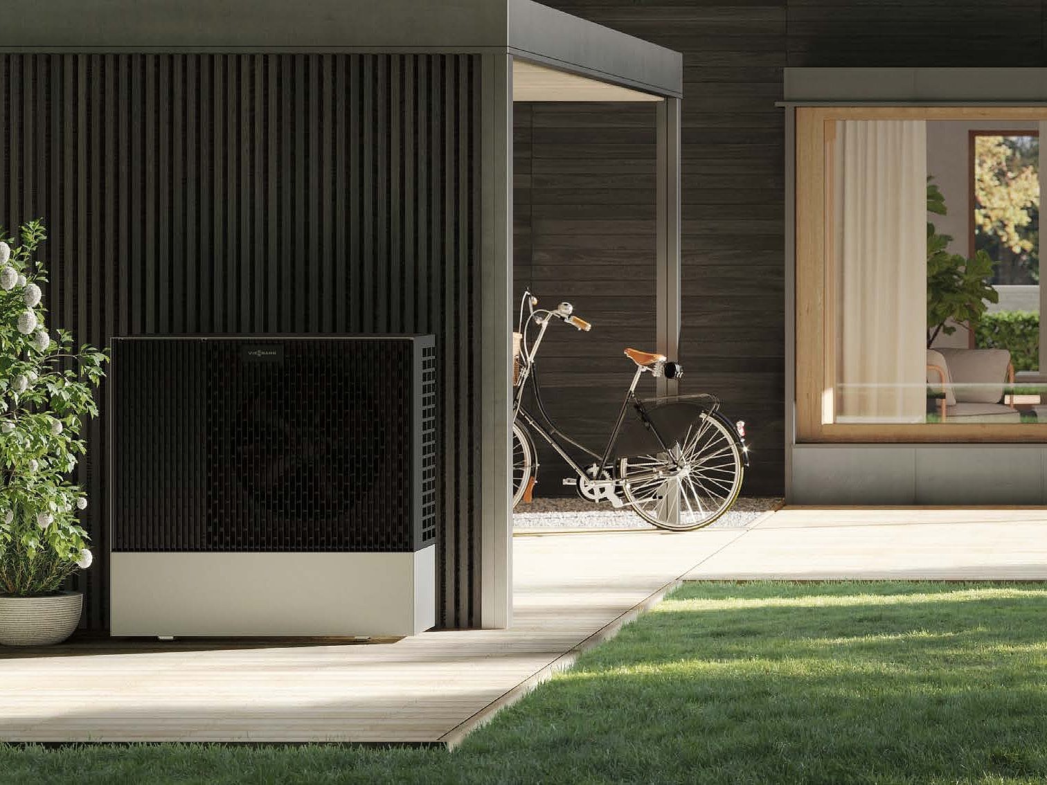 Elegantes Zuhause mit Wärmepumpe und Klimaanlage Ein modernes Haus mit einer stilvollen Wärmepumpe und einem schwarzen Fahrrad, das auf der Veranda abgestellt ist.